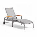 Gray outdoor lounge chair with wooden armrests and adjustable backrest